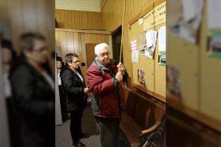 Gord Bertrim ringing the bell